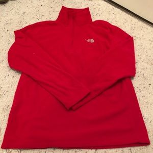 Red North Face pullover.